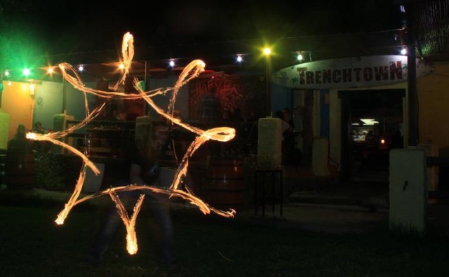 Duncan Greenwood performing anti-spin flower patterns with fire flower sticks - slow shutter photography. - Flow DNA